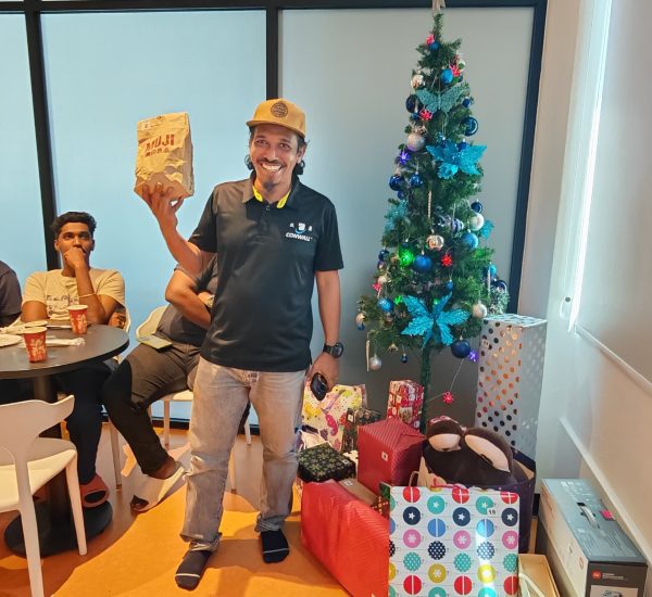 a man showing off his christmas gift