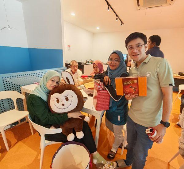 another employee showing off his christmas gift