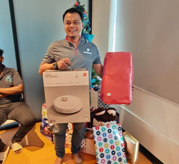 happily receiving his christmas gift